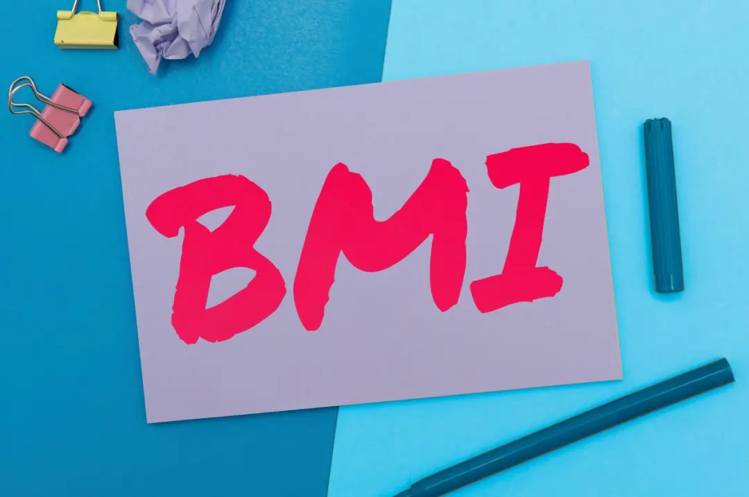 BMI card on desk — metabolic assessment is the starting point for safe weight management
